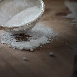 Fine mesh sieve dusting flour