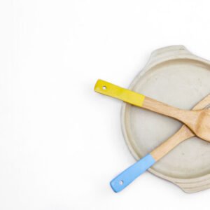 Wooden spatulas on a white plate