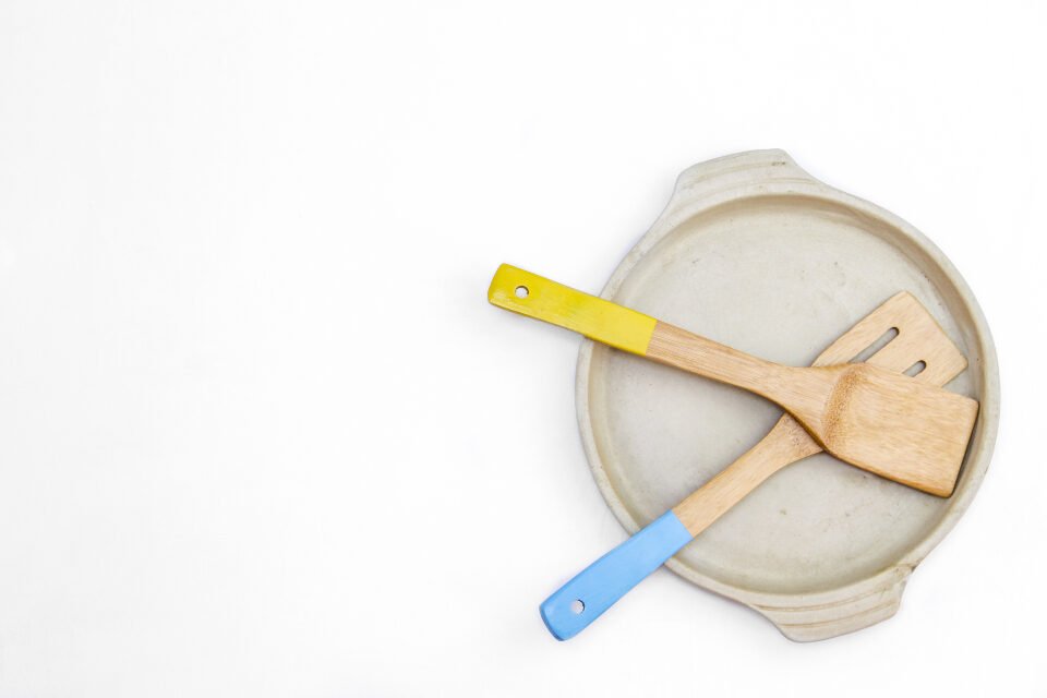 Wooden spatulas on a white plate